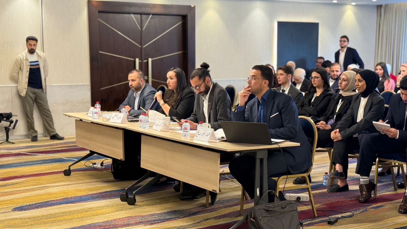 A second view of the judging panel and attendees at the entrepreneurial projects session