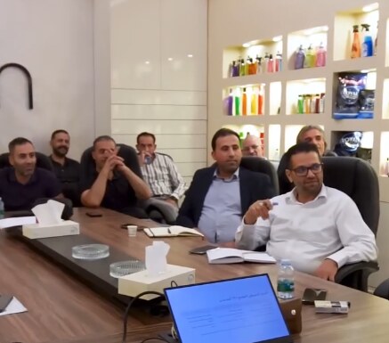 Participants seated around a table during a training session